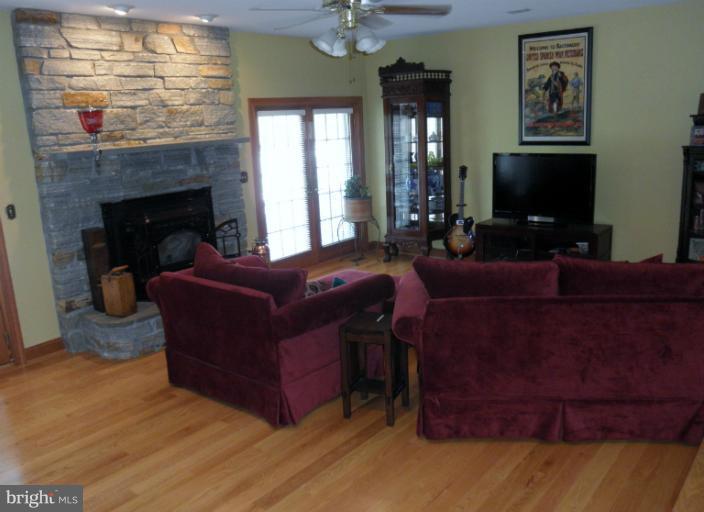 3995 Perry Hall Road Perry Hall, MD 21128 - Photo 25 of 26 a living room with furniture and a flat screen tv