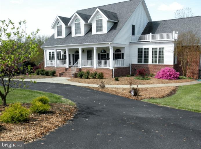3995 Perry Hall Road Perry Hall, MD 21128 - Photo 26 of 26 a front view of a house with a garden and yard