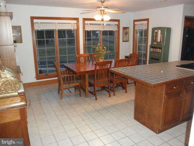 3995 Perry Hall Road Perry Hall, MD 21128 - Photo 5 of 26 a view of a dining room with furniture and chandelier