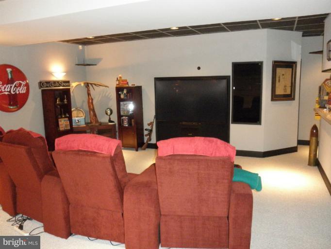 3995 Perry Hall Road Perry Hall, MD 21128 - Photo 6 of 26 a living room with couch and a flat screen tv