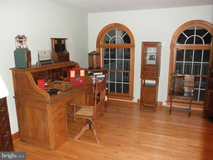 3995 Perry Hall Road Perry Hall, MD 21128 - Photo 10 of 26 a view of a workspace with furniture and wooden floor
