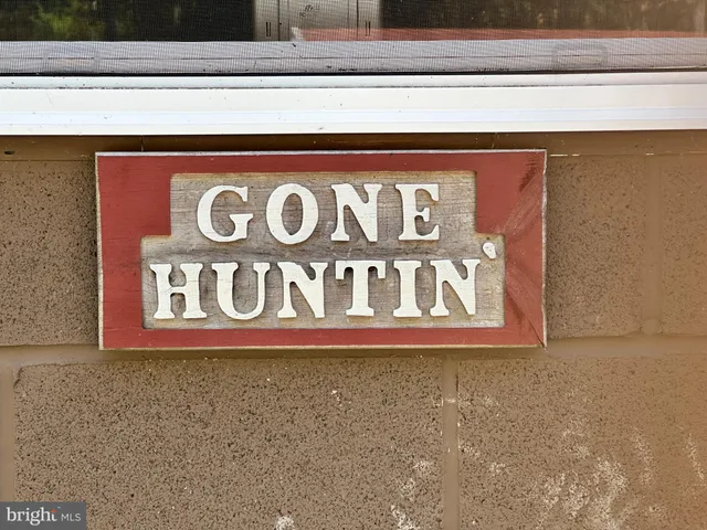 a bedroom with bed and window