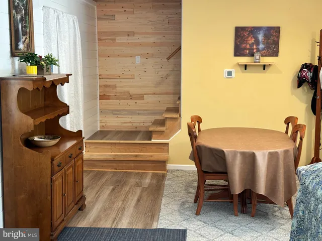 a bedroom with furniture and a flat screen tv