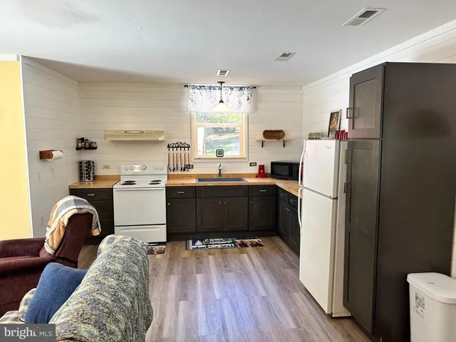 a kitchen with a sink cabinets and window
