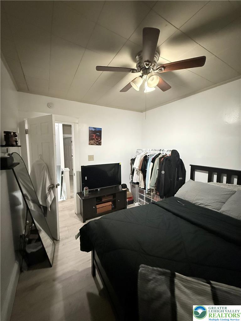 1025 Spring Street Bethlehem, PA 18018 - Photo 13 of 20 Relax in this well-lit bedroom featuring practical light wood flooring.