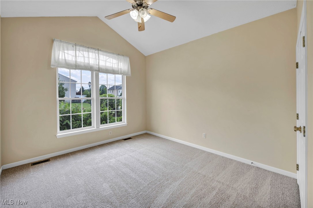 143 Stone Ridge Way Berea, OH 44017 - Photo 2 of 47 Carpeted empty room featuring ceiling fan and lofted ceiling