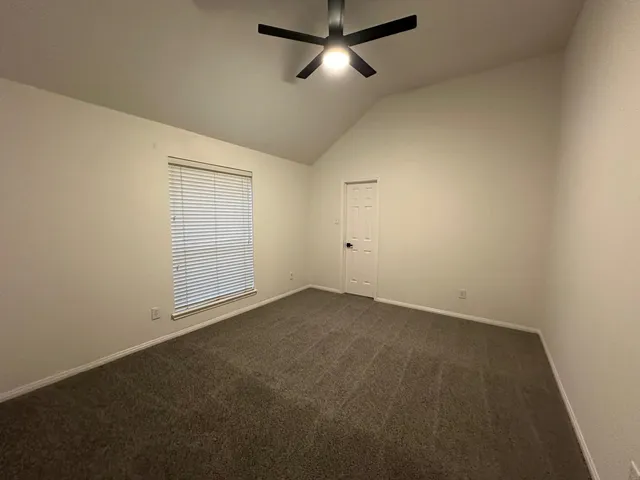 an empty room with a empty space and windows