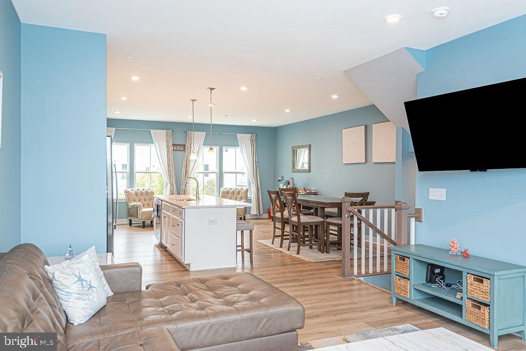 12461 Coastal Marsh Drive, Unit 708 Berlin, MD 21811 - Photo 19 of 56 a living room with furniture and a flat screen tv