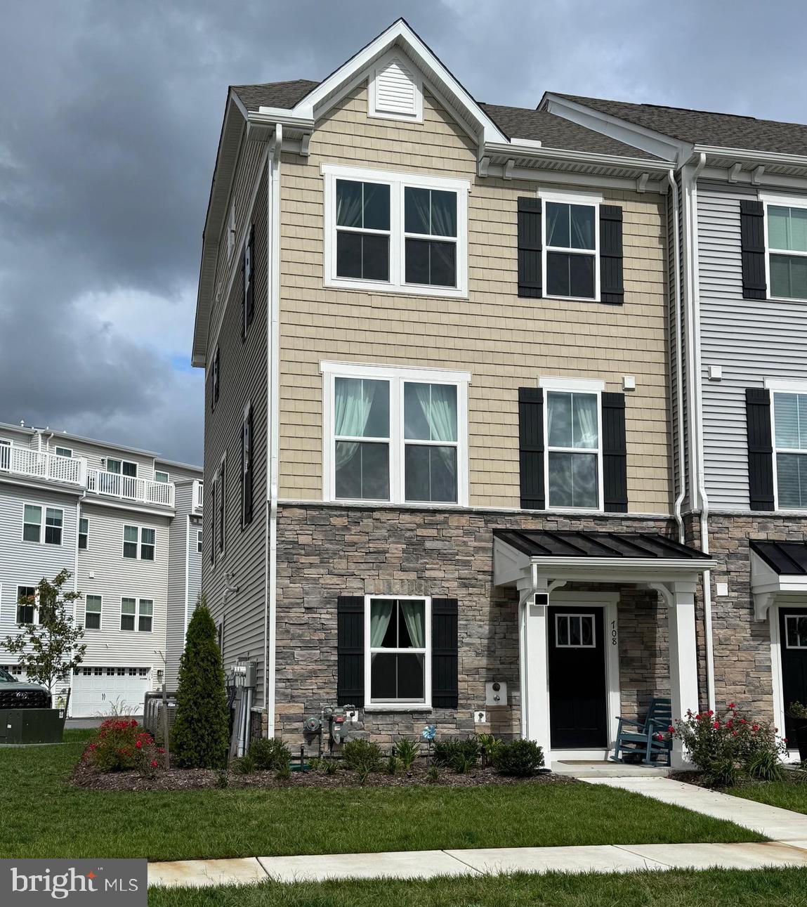 12461 Coastal Marsh Drive, Unit 708 Berlin, MD 21811 - Photo 2 of 56 a front view of a house with a yard