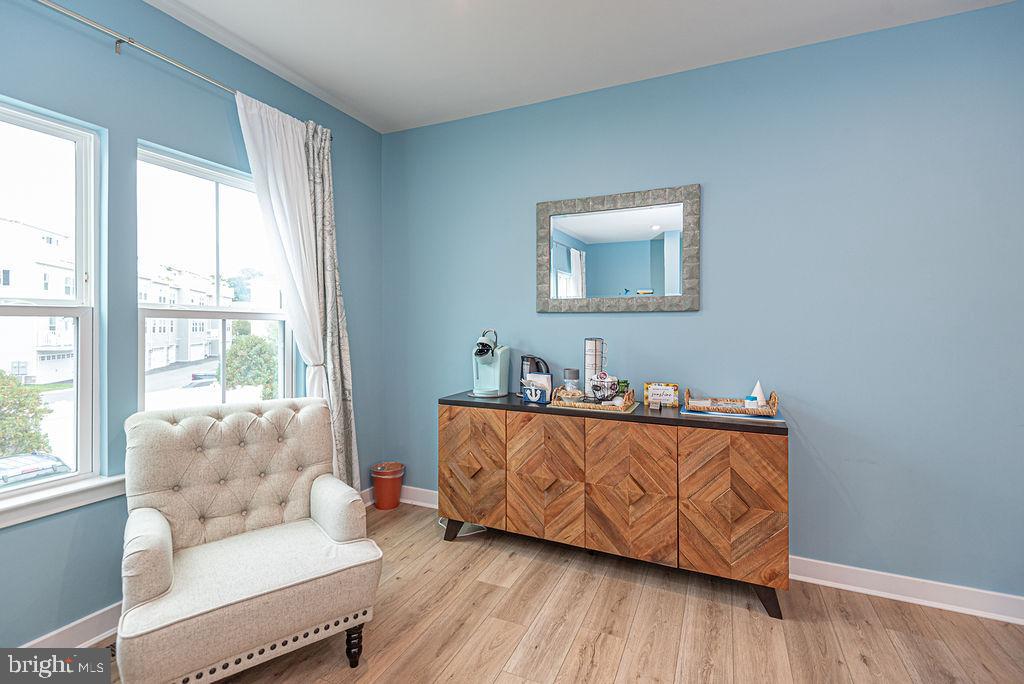 12461 Coastal Marsh Drive, Unit 708 Berlin, MD 21811 - Photo 23 of 56 a living room with furniture and a large window