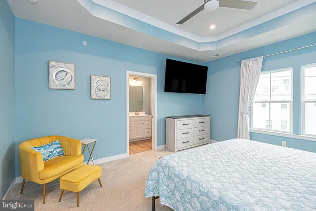 a bedroom with a bed and a chair