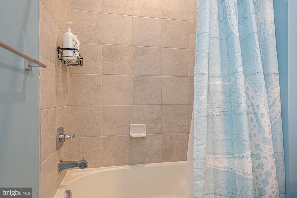 12461 Coastal Marsh Drive, Unit 708 Berlin, MD 21811 - Photo 35 of 56 a bathroom with a shower
