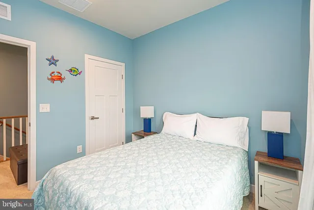 a view of a hallway with entryway wooden floor and front door
