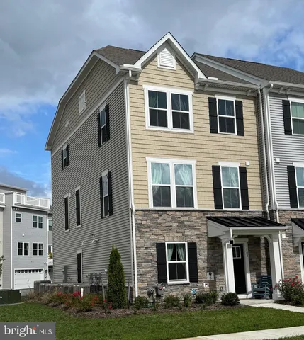 a front view of building with yard