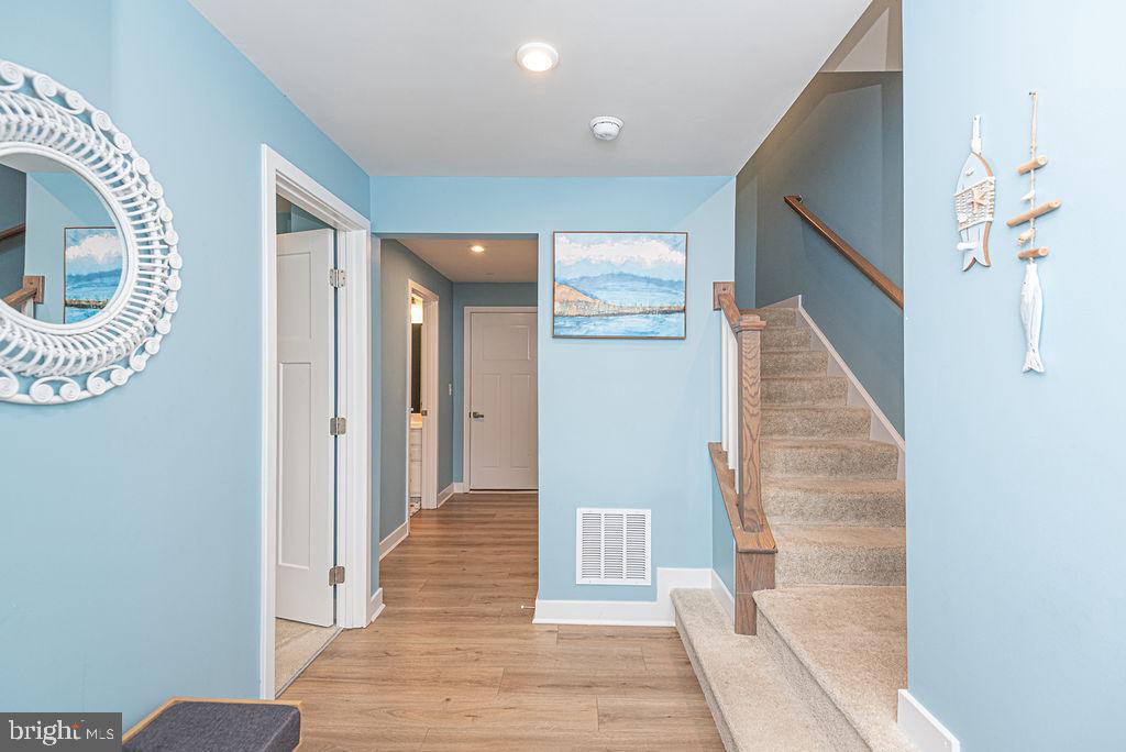 12461 Coastal Marsh Drive, Unit 708 Berlin, MD 21811 - Photo 42 of 56 a view of a hallway with entryway wooden floor and front door