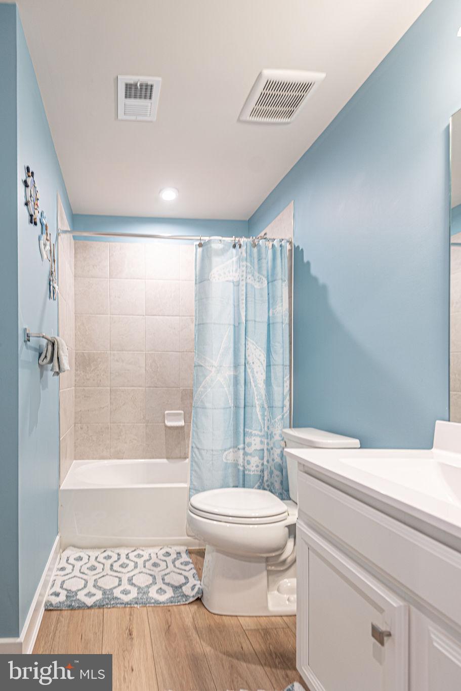 12461 Coastal Marsh Drive, Unit 708 Berlin, MD 21811 - Photo 45 of 56 a bathroom with a toilet a sink and shower