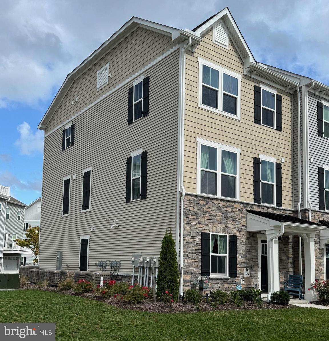 12461 Coastal Marsh Drive, Unit 708 Berlin, MD 21811 - Photo 5 of 56 a front view of a house with a yard