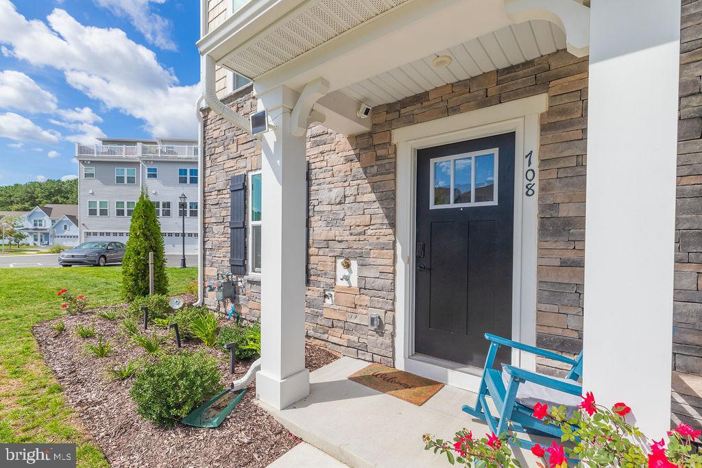 12461 Coastal Marsh Drive, Unit 708 Berlin, MD 21811 - Photo 7 of 56 a front view of a house with a yard