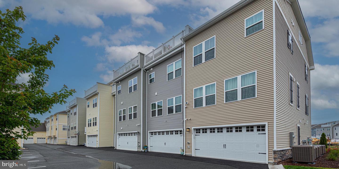 12461 Coastal Marsh Drive, Unit 708 Berlin, MD 21811 - Photo 8 of 56 a view of a large building with many windows