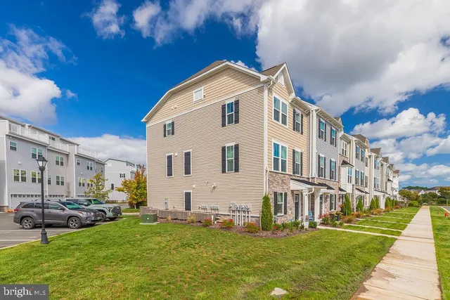 a front view of building with yard