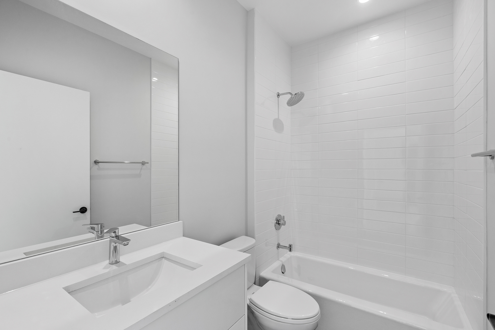 3953 West Dakin Street, Unit 405 Chicago, IL 60618 - Photo 10 of 21 a bathroom with a sink toilet and shower