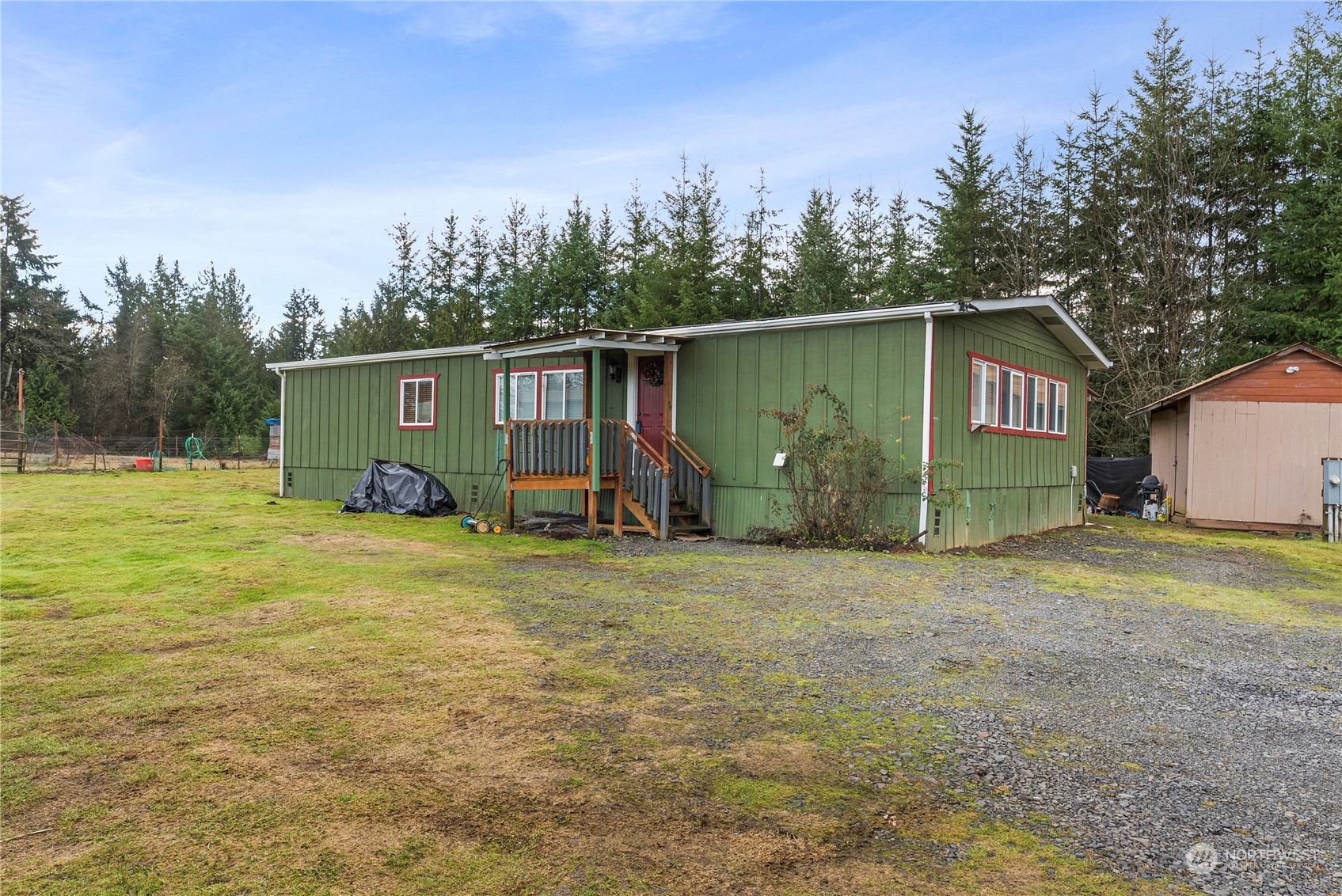 267 Limmer Road Winlock, WA 98596 - Photo 1 of 25 a view of a house with backyard and trees