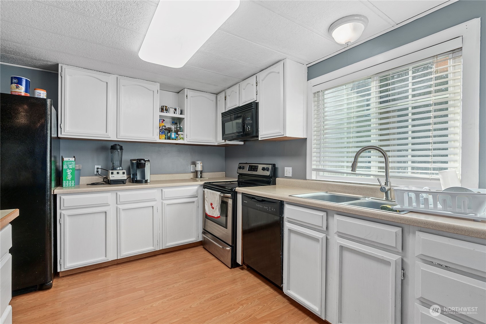 267 Limmer Road Winlock, WA 98596 - Photo 8 of 25 a kitchen with stainless steel appliances granite countertop a sink stove cabinets and a refrigerator
