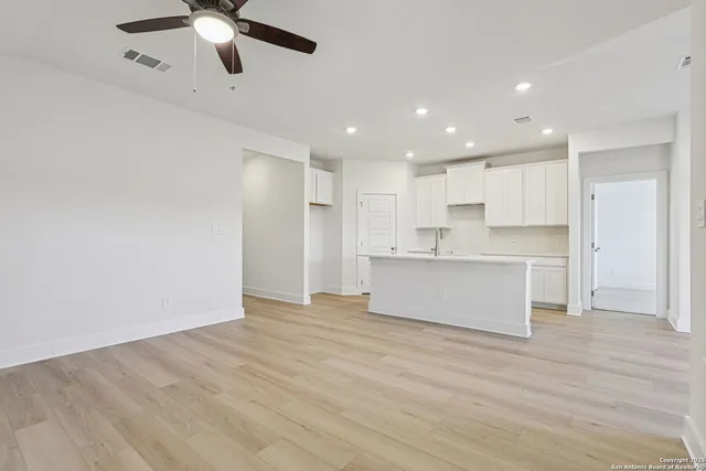 a view of kitchen with granite countertop cabinets and stainless steel appliances