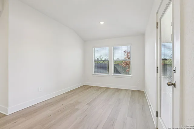 a view of an empty room with a window
