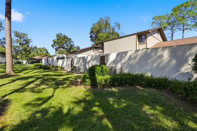 an aerial view of residential house with outdoor space and swimming pool