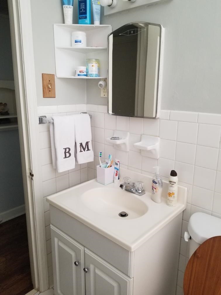 4407 Owen Road Memphis, TN 38122 - Photo 11 of 14 a bathroom with a sink and a mirror