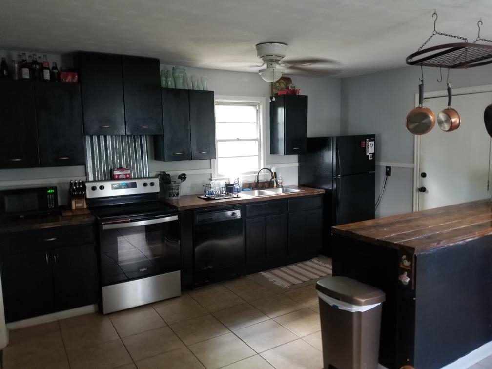 4407 Owen Road Memphis, TN 38122 - Photo 3 of 14 a kitchen with a sink appliances and cabinets
