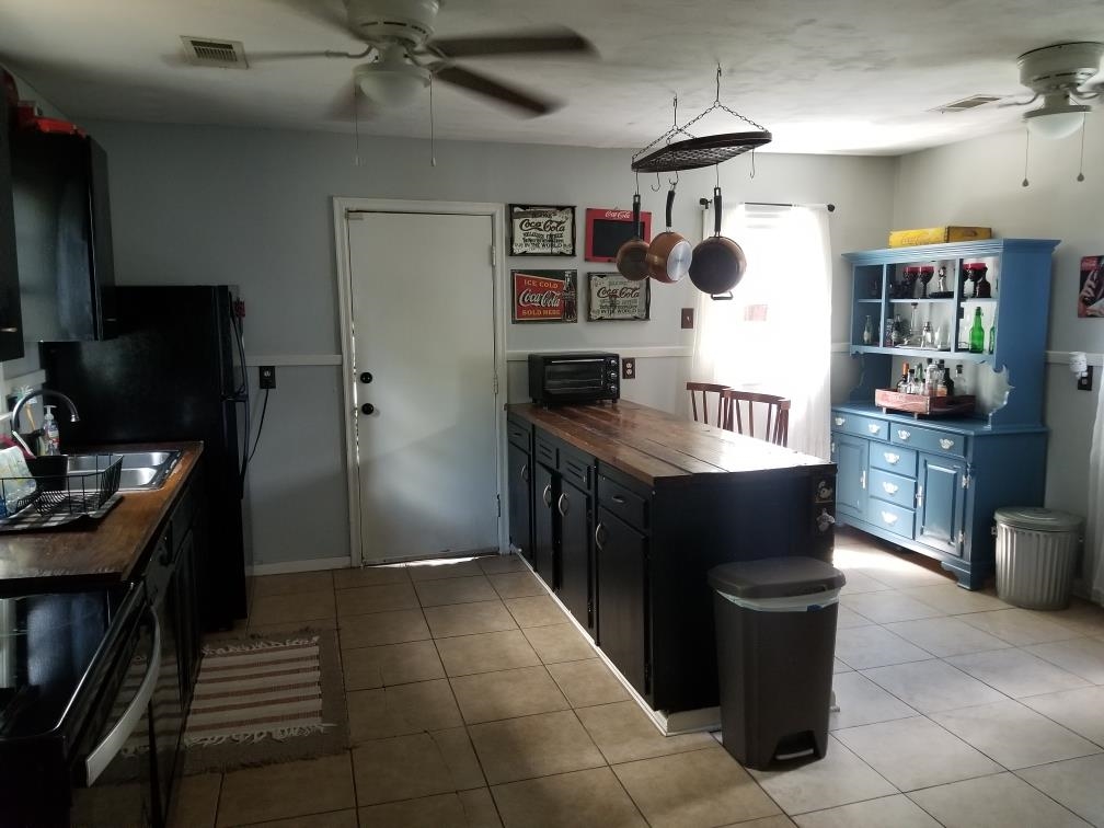 4407 Owen Road Memphis, TN 38122 - Photo 5 of 14 a kitchen with cabinets and refrigerator