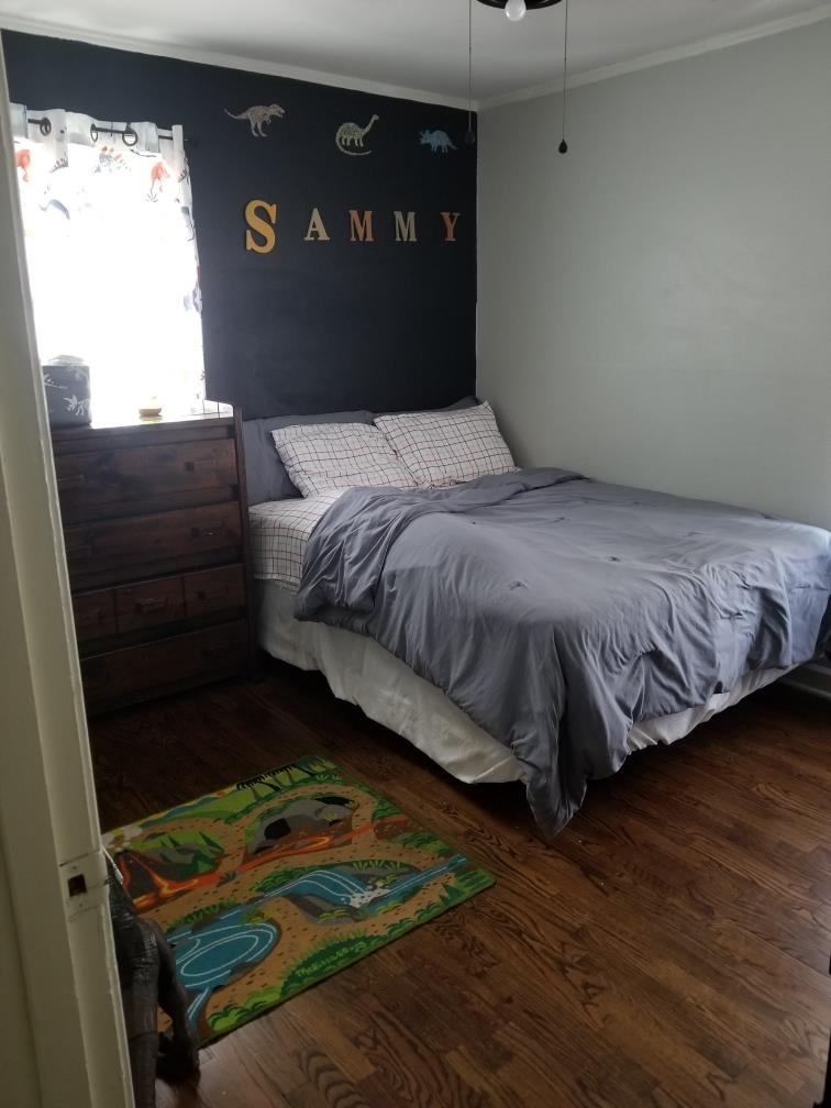 4407 Owen Road Memphis, TN 38122 - Photo 10 of 14 a bedroom with a bed dresser and a window