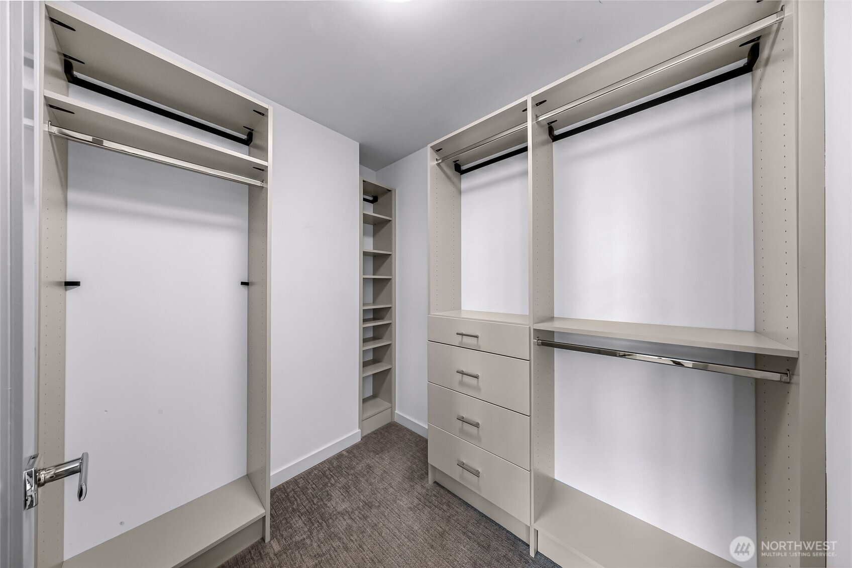 4218 Linden Avenue North Seattle, WA 98103 - Photo 22 of 38 a view of walk in closet with empty racks