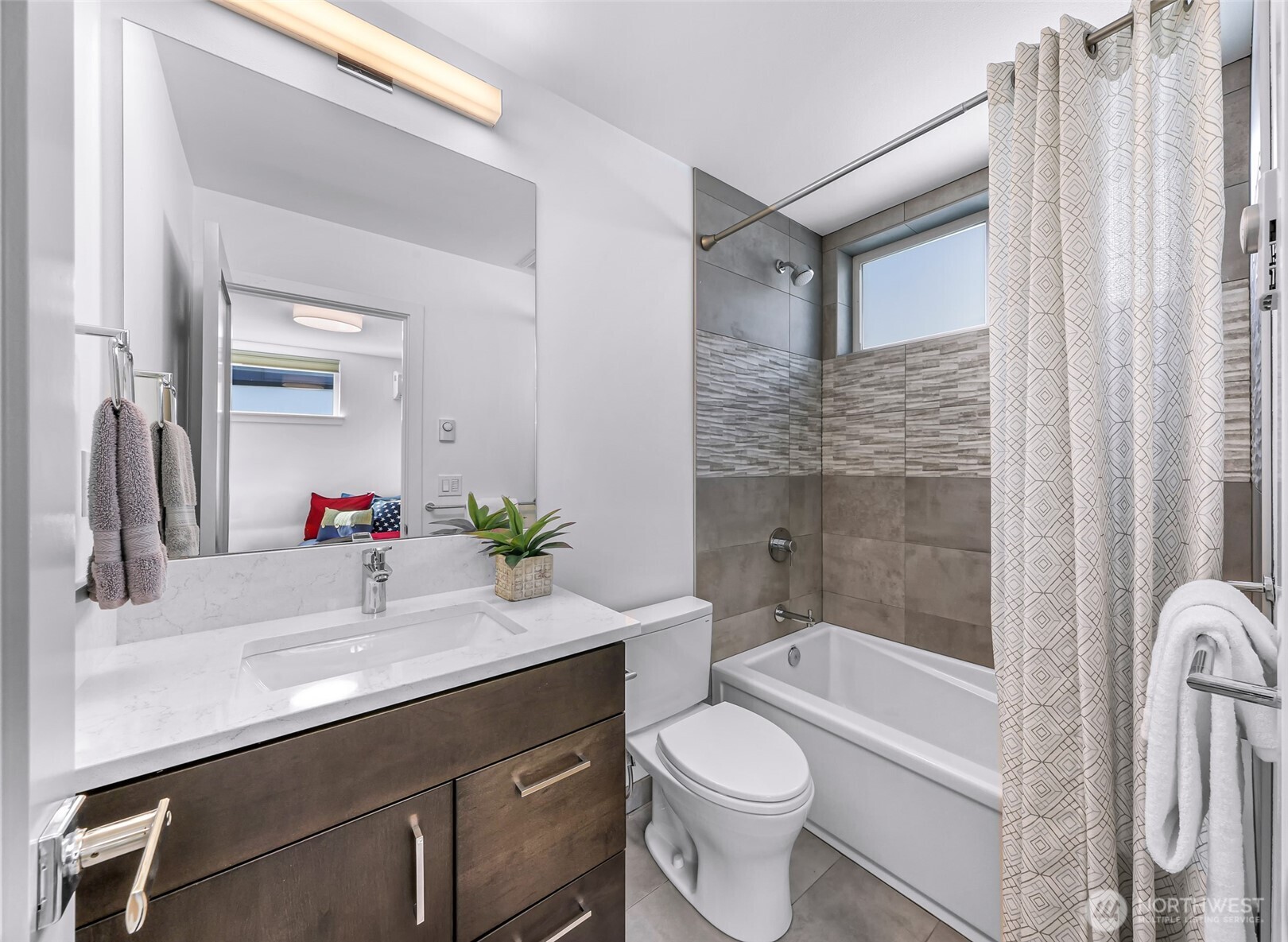 4218 Linden Avenue North Seattle, WA 98103 - Photo 25 of 38 a bathroom with a sink a toilet and a bathtub