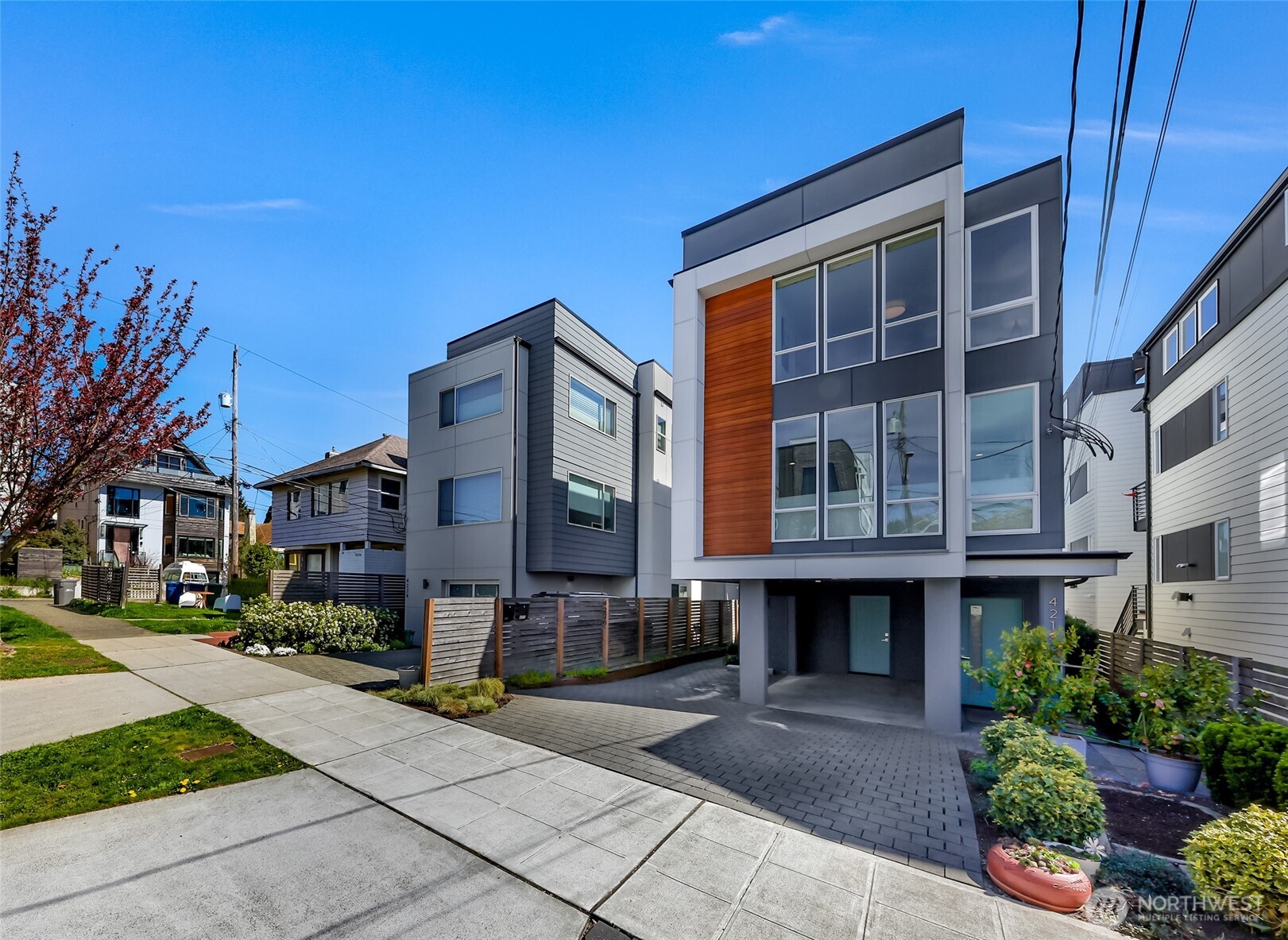 4218 Linden Avenue North Seattle, WA 98103 - Photo 3 of 38 a front view of a building with a garden