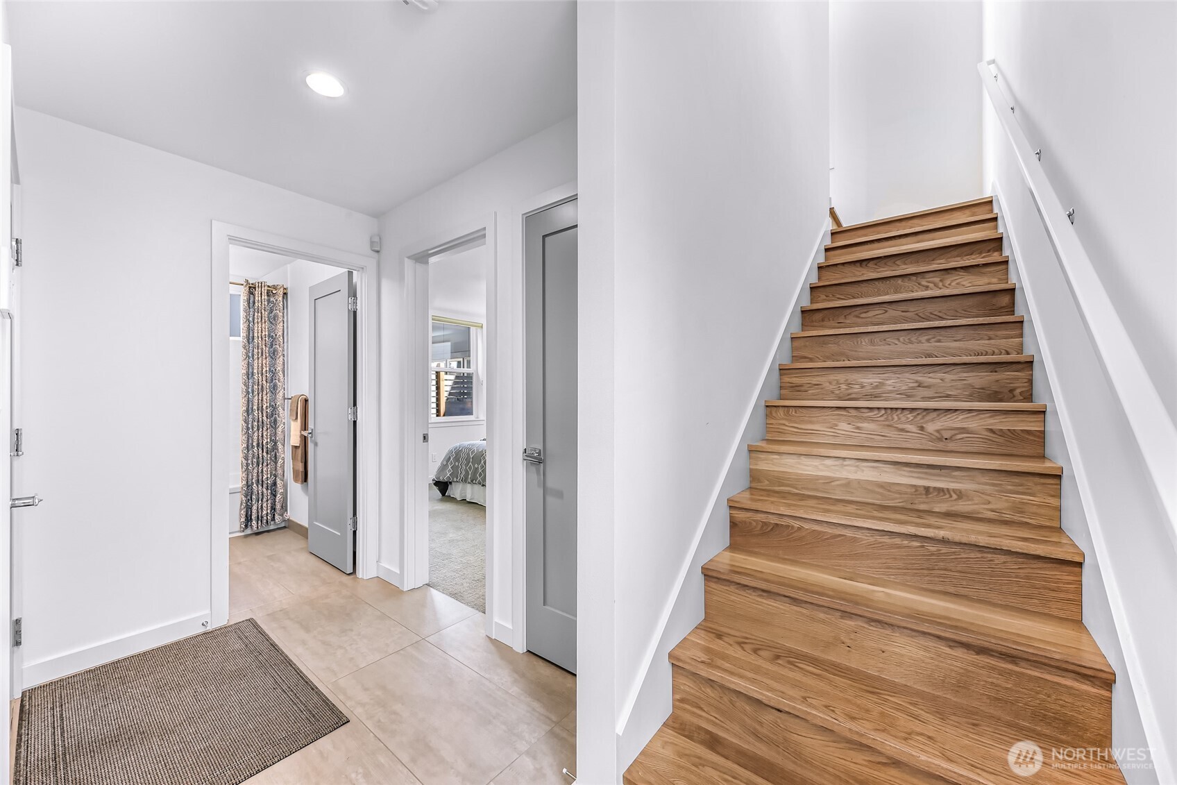 4218 Linden Avenue North Seattle, WA 98103 - Photo 5 of 38 a view of a hallway with wooden floor and entryway