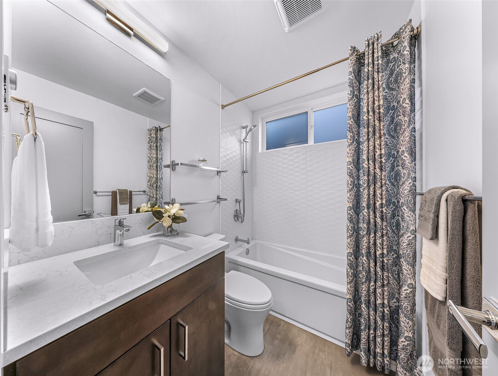 4218 Linden Avenue North Seattle, WA 98103 - Photo 8 of 38 a bathroom with a sink a toilet and shower
