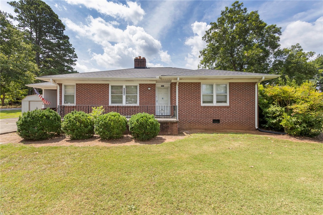 1218 Bolt Drive Anderson, SC 29621 - Photo 2 of 46 A classic brick exterior and welcoming front lawn offer charming curb appeal.