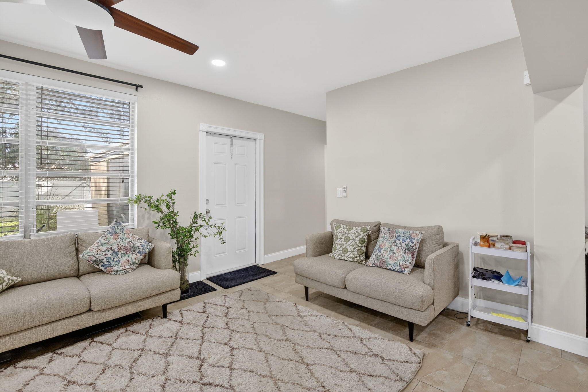 5507 McKinley Street Hollywood, FL 33021 - Photo 20 of 60 a living room with furniture and flowers