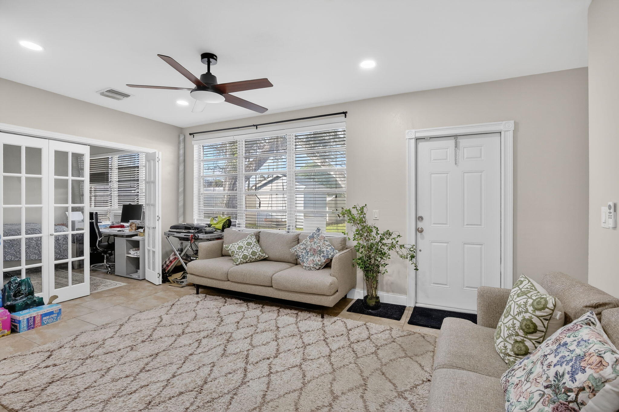 5507 McKinley Street Hollywood, FL 33021 - Photo 21 of 60 a living room with furniture and a potted plant