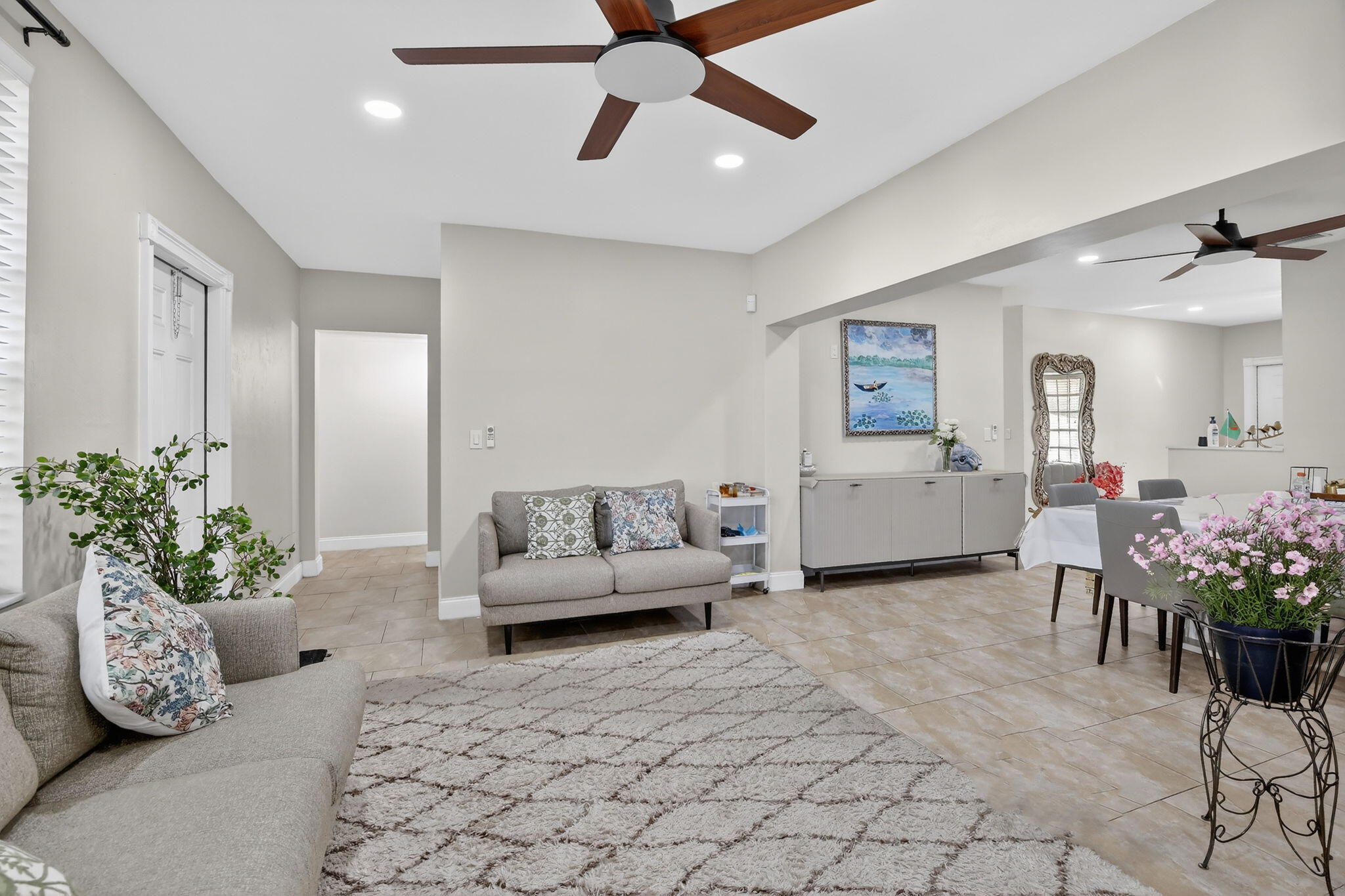 5507 McKinley Street Hollywood, FL 33021 - Photo 23 of 60 a living room with furniture and flowers