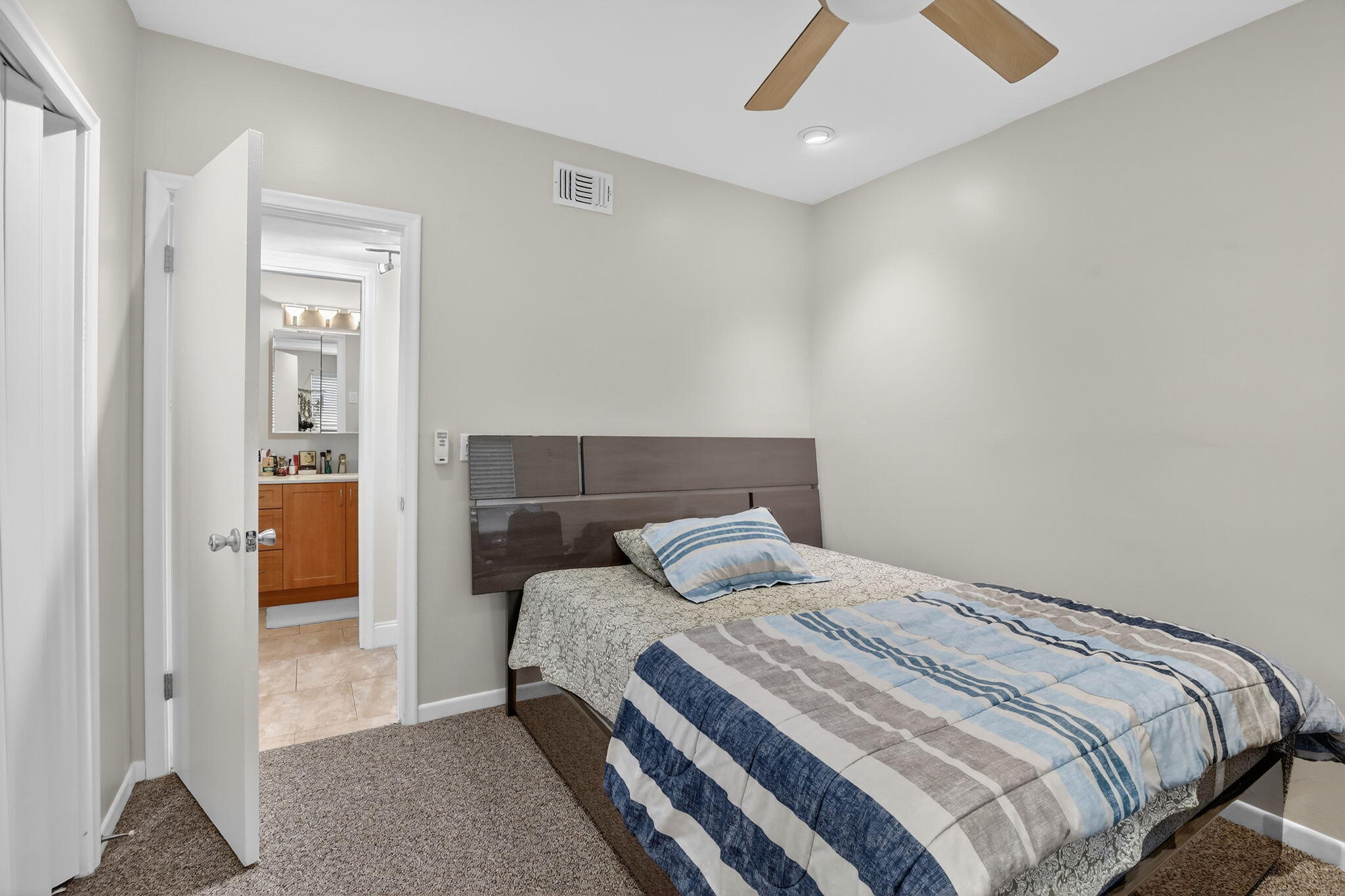 5507 McKinley Street Hollywood, FL 33021 - Photo 35 of 60 a bedroom with a bed and a walk in closet