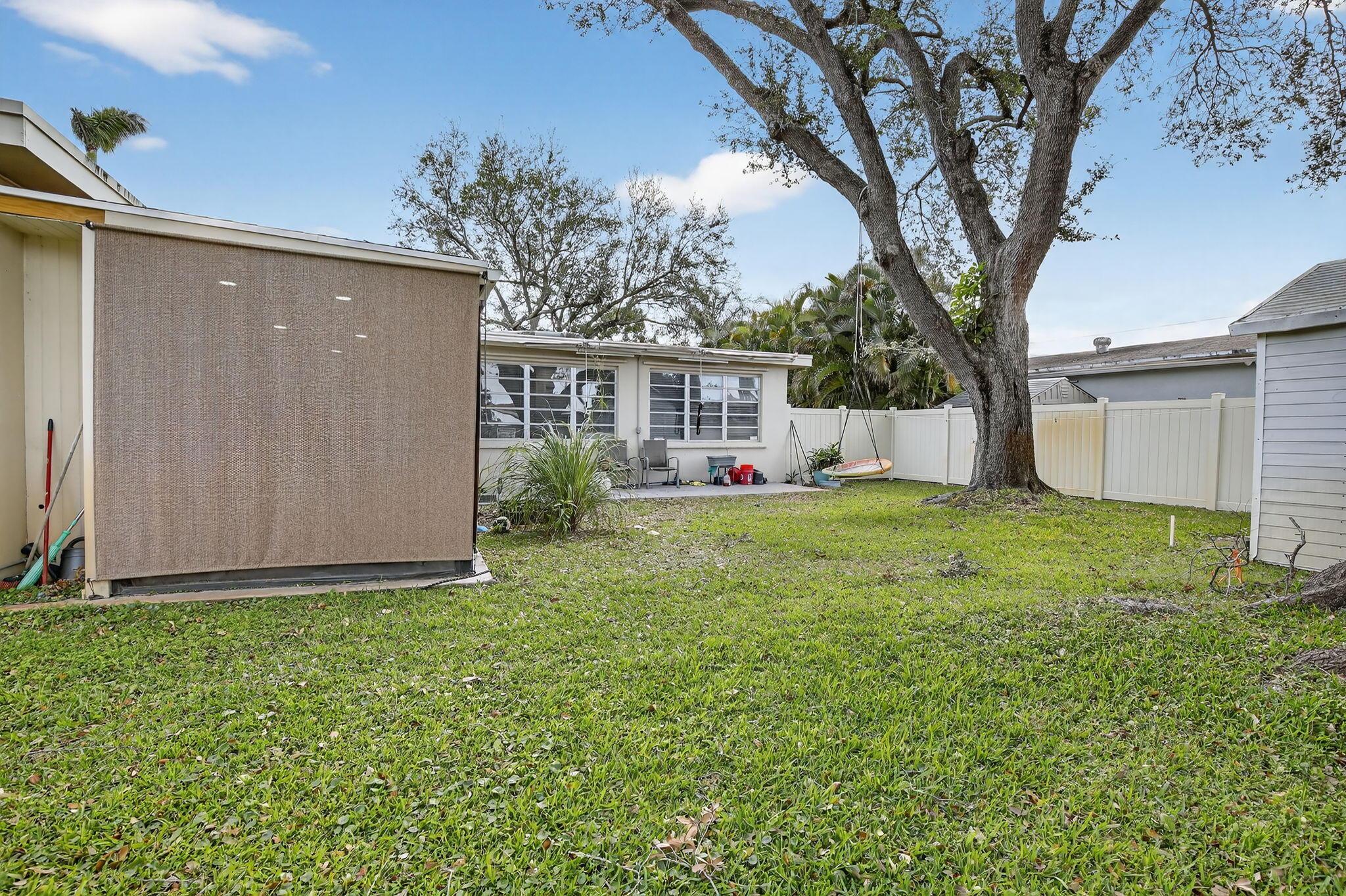 5507 McKinley Street Hollywood, FL 33021 - Photo 49 of 60 a view of a house with backyard and sitting area