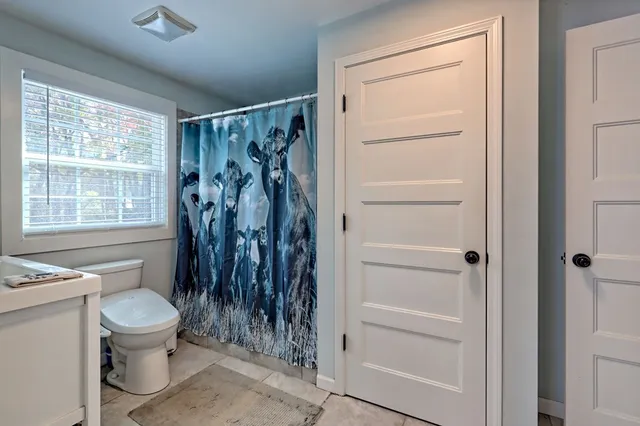 a view of a hallway with washer and dryer