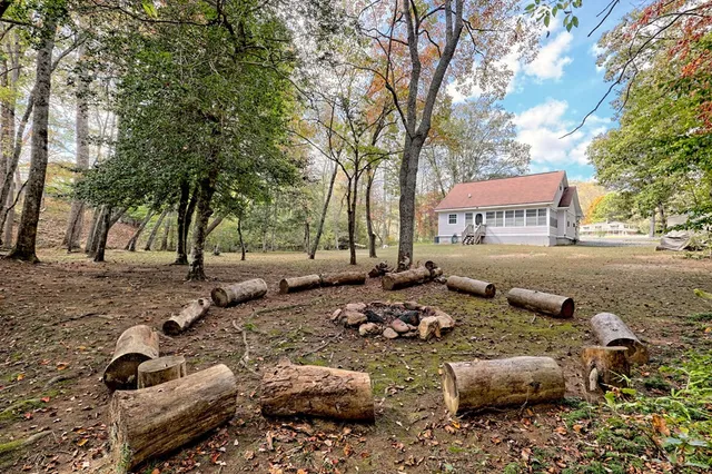 a pathway of a house with a yard