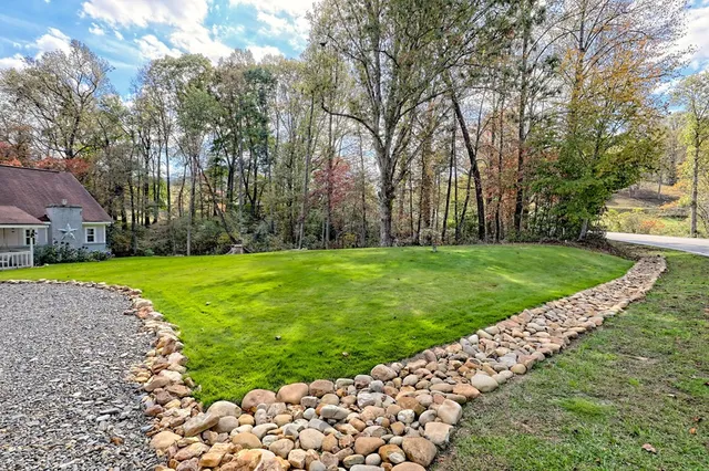 a view of a house with a big yard