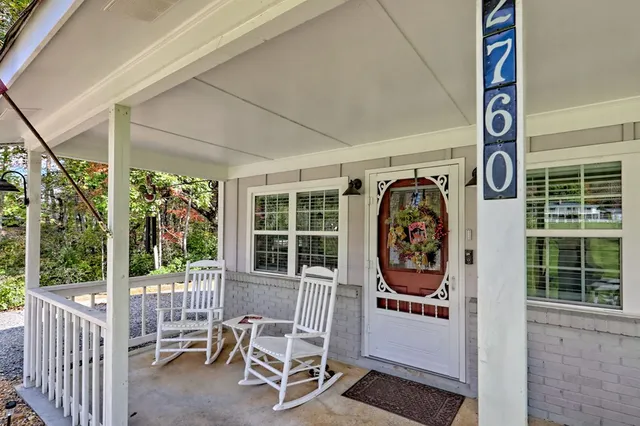 a view of a bench in the porch