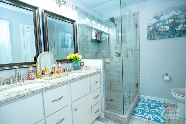 a bedroom with a bed and a dresser in it